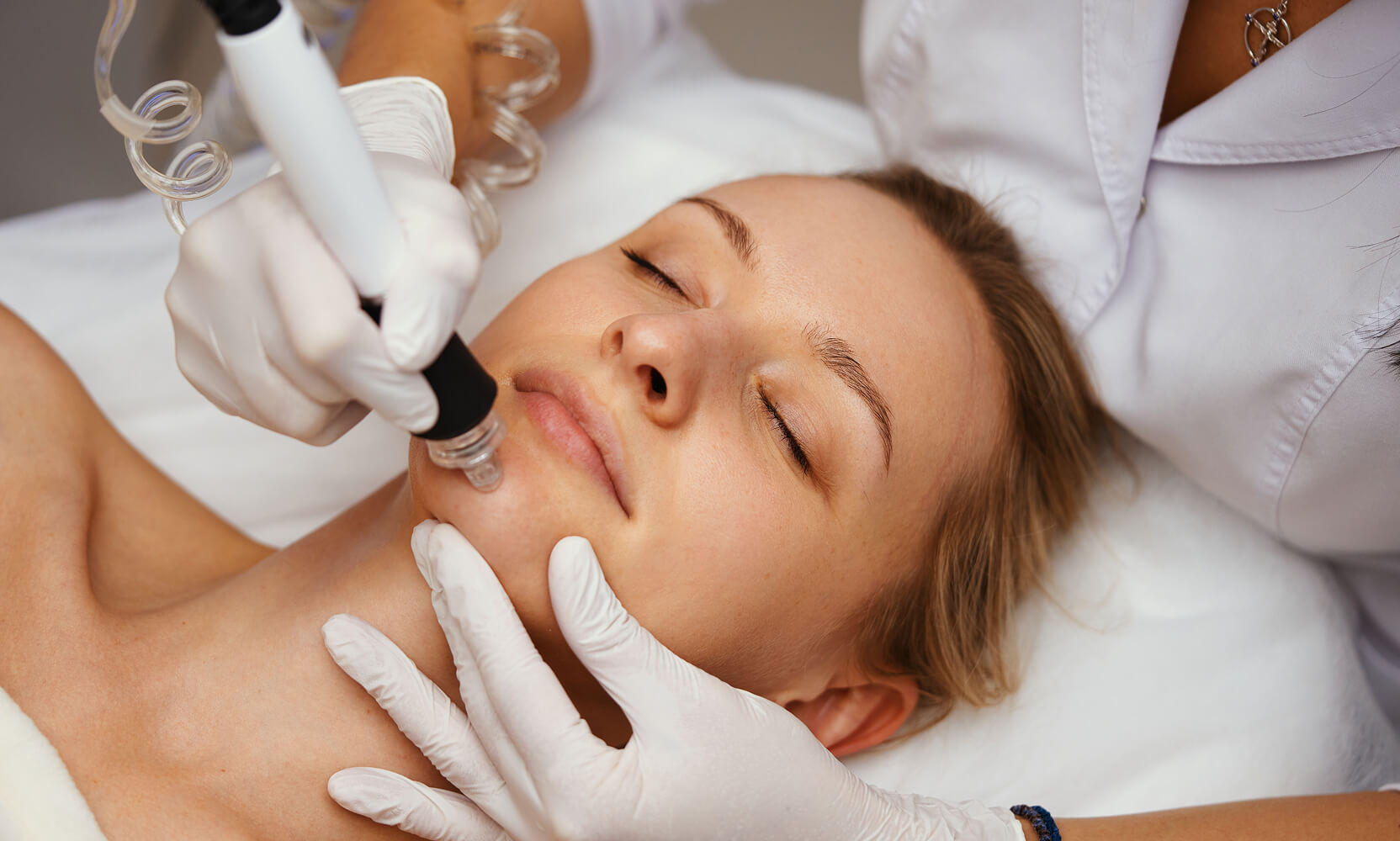 Patient receiving an advanced facial add-on treatment at Coral Dermatology